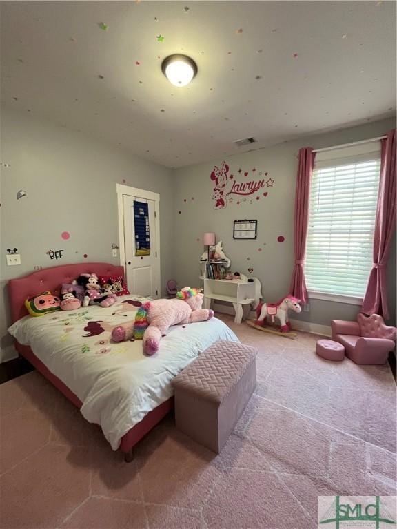 bedroom with carpet floors and visible vents