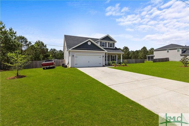 40 Saddlebrush Rd, Ellabell, GA 31308 - view of front of house with a front lawn, fence, an attached garage, and driveway