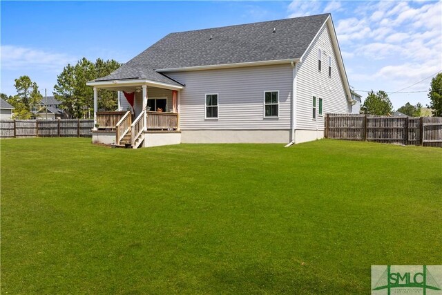 40 Saddlebrush Rd, Ellabell, GA 31308 - rear view of house with a shingled roof, a yard, and a fenced backyard