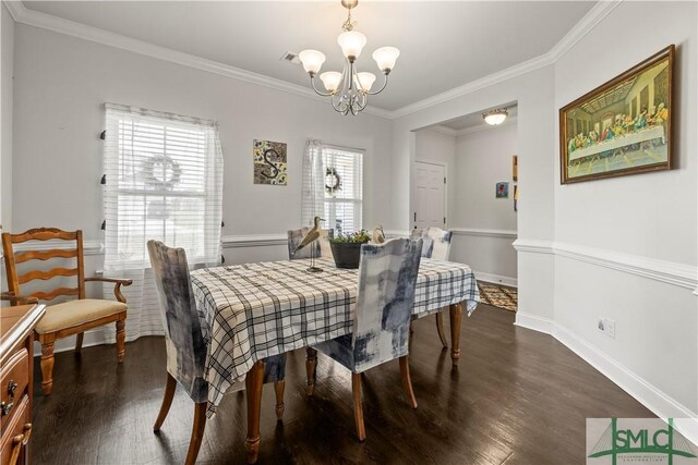 40 Saddlebrush Rd, Ellabell, GA 31308 - dining area with dark wood-type flooring, crown molding, a notable chandelier, and baseboards