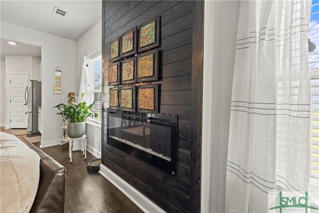 40 Saddlebrush Rd, Ellabell, GA 31308 - interior space featuring visible vents, baseboards, and wood finished floors