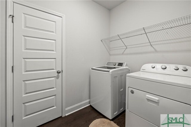 40 Saddlebrush Rd, Ellabell, GA 31308 - clothes washing area featuring dark wood-type flooring, laundry area, baseboards, and washer and clothes dryer