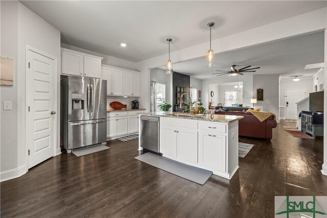 40 Saddlebrush Rd, Ellabell, GA 31308 - kitchen featuring open floor plan, white cabinets, ceiling fan, stainless steel appliances, and a sink