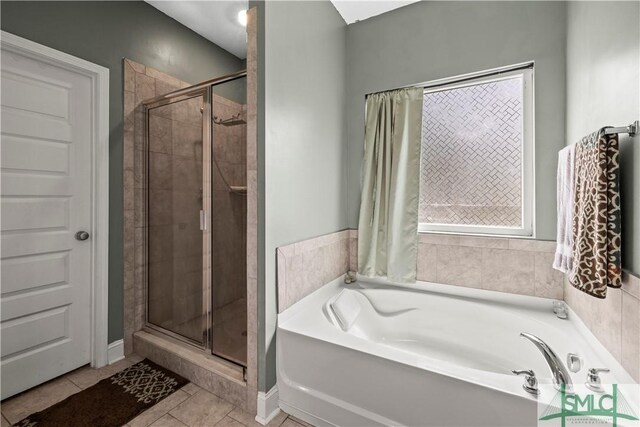 40 Saddlebrush Rd, Ellabell, GA 31308 - bathroom featuring tile patterned floors, a bath, and a shower stall