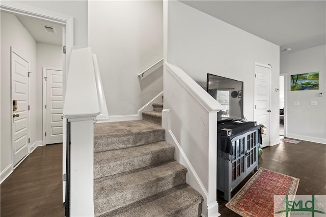 40 Saddlebrush Rd, Ellabell, GA 31308 - staircase featuring visible vents, baseboards, and wood finished floors