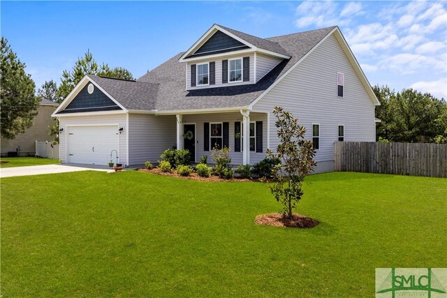 40 Saddlebrush Rd, Ellabell, GA 31308 - craftsman house featuring driveway, an attached garage, fence, and a front lawn