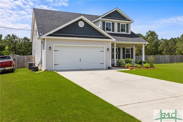 40 Saddlebrush Rd, Ellabell, GA 31308 - view of front facade featuring fence, a front lawn, an attached garage, concrete driveway, and central AC unit