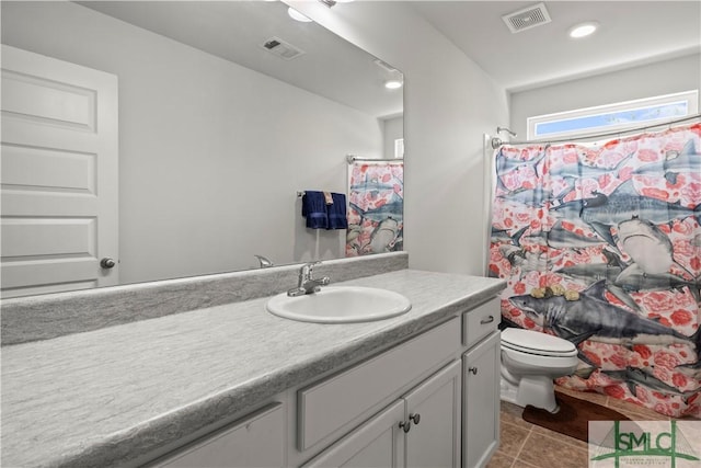 40 Saddlebrush Rd, Ellabell, GA 31308 - bathroom with toilet, vanity, tile patterned flooring, and visible vents