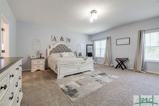 106 Cedar Ridge Dr, Guyton, GA 31312 - bedroom featuring light colored carpet, multiple windows, and baseboards