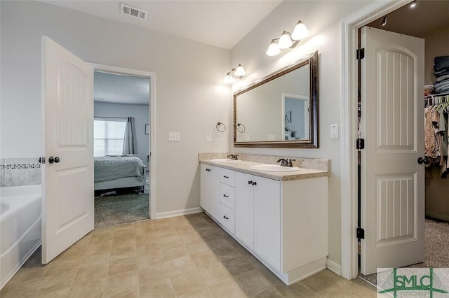 106 Cedar Ridge Dr, Guyton, GA 31312 - full bath with ensuite bath, double vanity, a bath, and baseboards