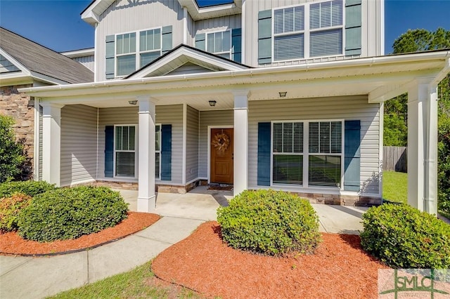 106 Cedar Ridge Dr, Guyton, GA 31312 - view of front of house featuring covered porch and stone siding