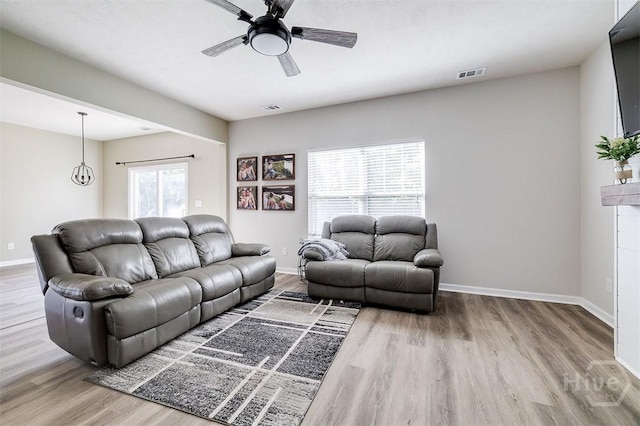 106 Cedar Ridge Dr, Guyton, GA 31312 - living room featuring wood finished floors, ceiling fan, and baseboards