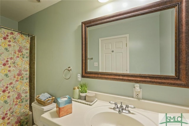 full bath with a shower with shower curtain, toilet, and vanity