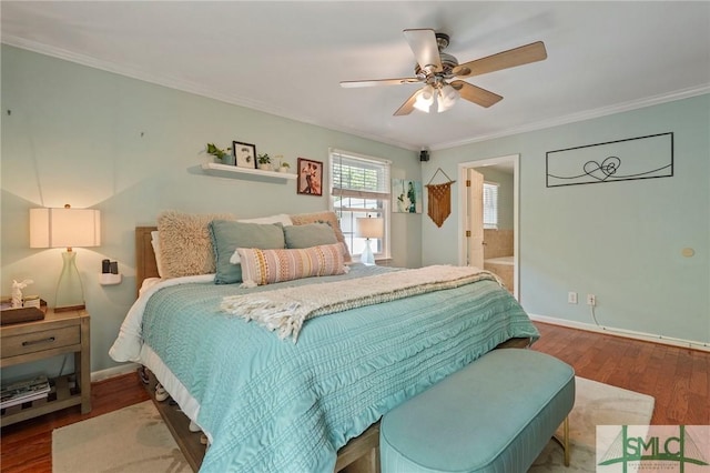 bedroom featuring ensuite bath, crown molding, a ceiling fan, baseboards, and wood finished floors