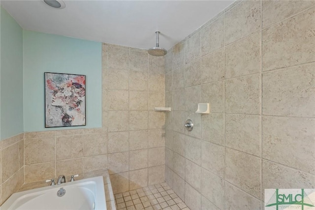 bathroom with a bath and tiled shower