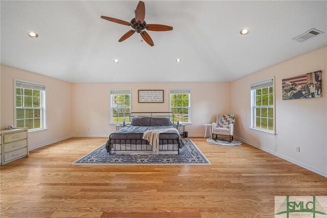 229 Golden Dr, Rincon, GA 31326 - bedroom with recessed lighting, light wood-style floors, baseboards, visible vents, and lofted ceiling
