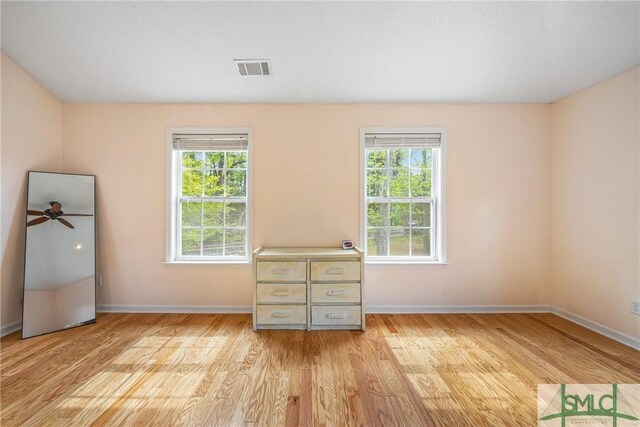 229 Golden Dr, Rincon, GA 31326 - unfurnished bedroom featuring light wood-style floors, visible vents, and baseboards