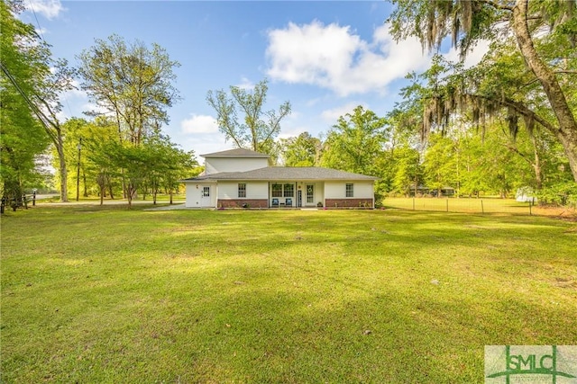 229 Golden Dr, Rincon, GA 31326 - rear view of property with fence and a lawn