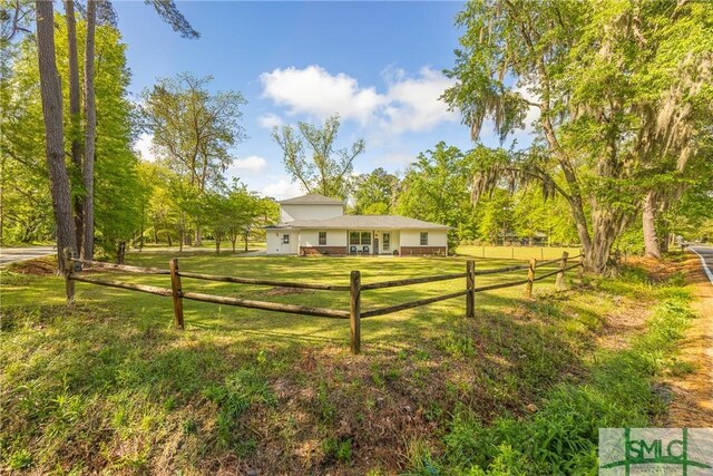 229 Golden Dr, Rincon, GA 31326 - view of community with fence and a lawn