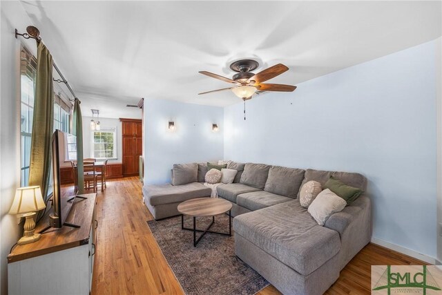 229 Golden Dr, Rincon, GA 31326 - living area with wood finished floors, ceiling fan, and baseboards