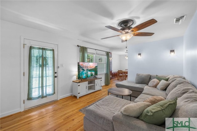 229 Golden Dr, Rincon, GA 31326 - living area with light wood-type flooring, visible vents, a ceiling fan, and baseboards