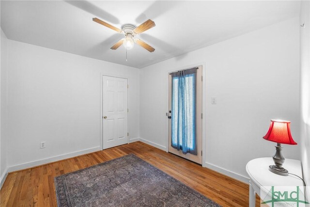 229 Golden Dr, Rincon, GA 31326 - foyer entrance featuring a ceiling fan, wood finished floors, and baseboards