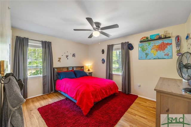 229 Golden Dr, Rincon, GA 31326 - bedroom featuring light wood-type flooring, a ceiling fan, and baseboards