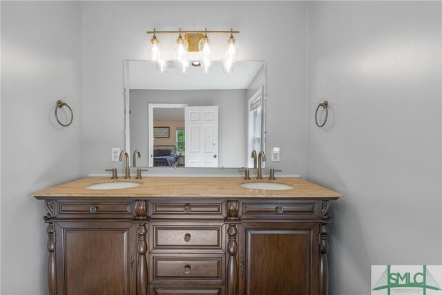 229 Golden Dr, Rincon, GA 31326 - full bath with ensuite bath, double vanity, and a sink