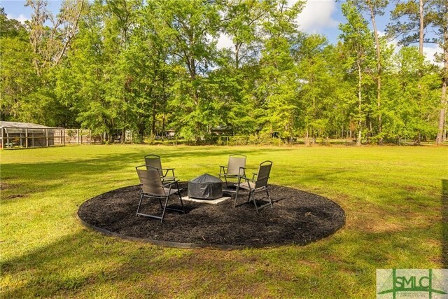229 Golden Dr, Rincon, GA 31326 - view of yard with an outdoor fire pit