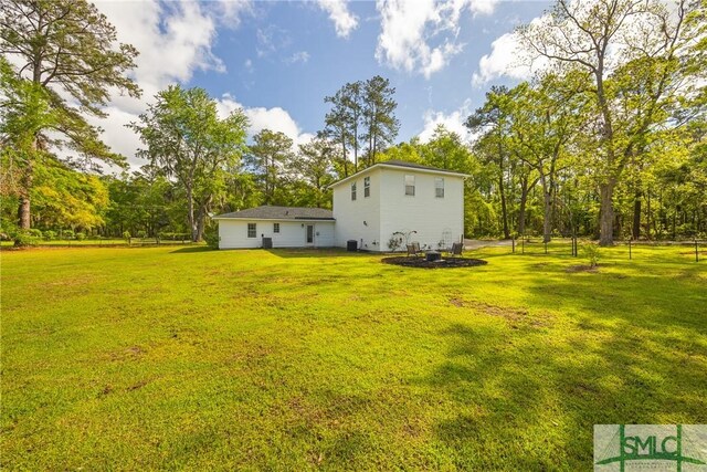 229 Golden Dr, Rincon, GA 31326 - rear view of house featuring a yard