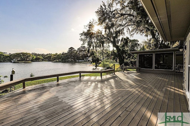 wooden deck with a water view