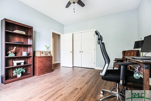 office space with ceiling fan, baseboards, and wood finished floors