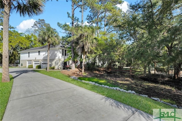 116 Brevard Ct, Savannah, GA 31410 - view of front facade with driveway and view of scattered trees