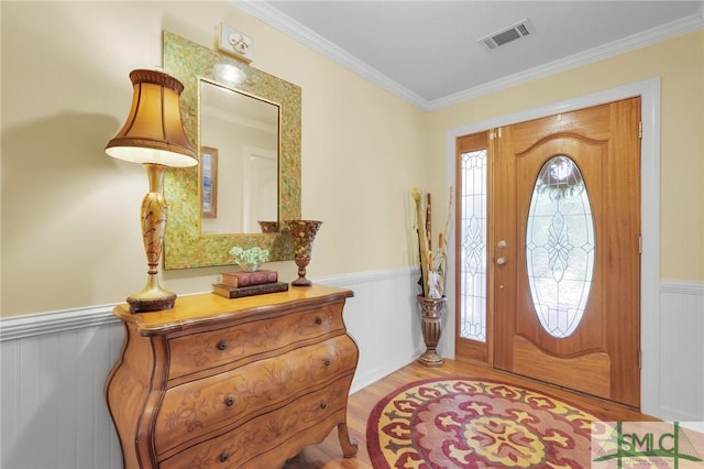 116 Brevard Ct, Savannah, GA 31410 - entrance foyer with a wainscoted wall, ornamental molding, and wood finished floors