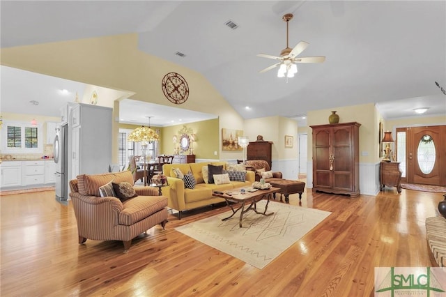 116 Brevard Ct, Savannah, GA 31410 - living area featuring plenty of natural light, wainscoting, high vaulted ceiling, ceiling fan, and light wood-style floors