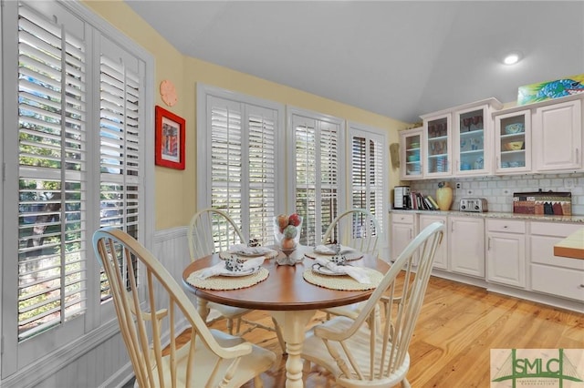 116 Brevard Ct, Savannah, GA 31410 - dining area with light wood-style floors, wainscoting, and vaulted ceiling