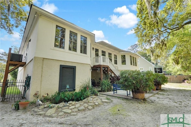 116 Brevard Ct, Savannah, GA 31410 - view of front of home featuring stucco siding, stairs, and a patio