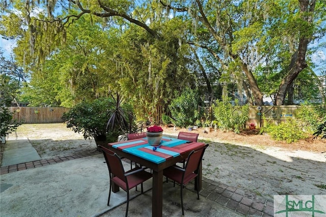 116 Brevard Ct, Savannah, GA 31410 - fenced backyard featuring a patio area and outdoor dining space