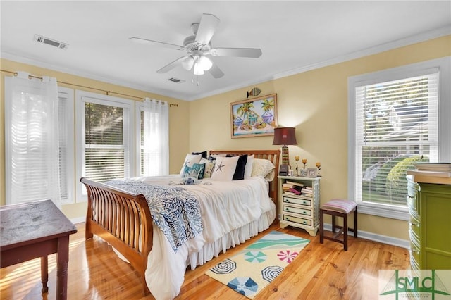 116 Brevard Ct, Savannah, GA 31410 - bedroom featuring multiple windows, crown molding, light wood-type flooring, ceiling fan, and baseboards