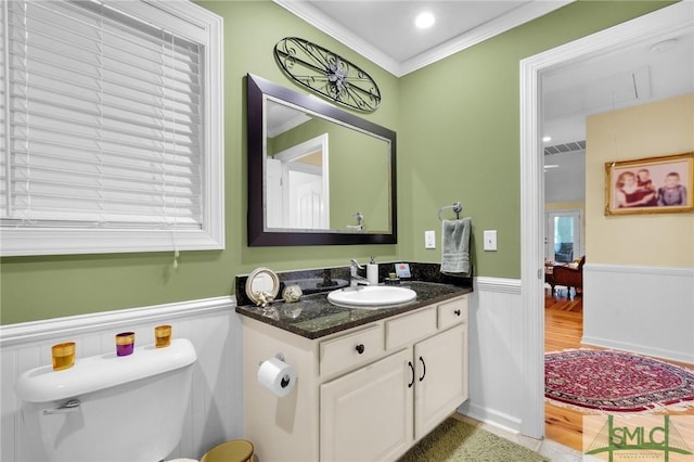 116 Brevard Ct, Savannah, GA 31410 - bathroom featuring wainscoting, ornamental molding, vanity, and toilet