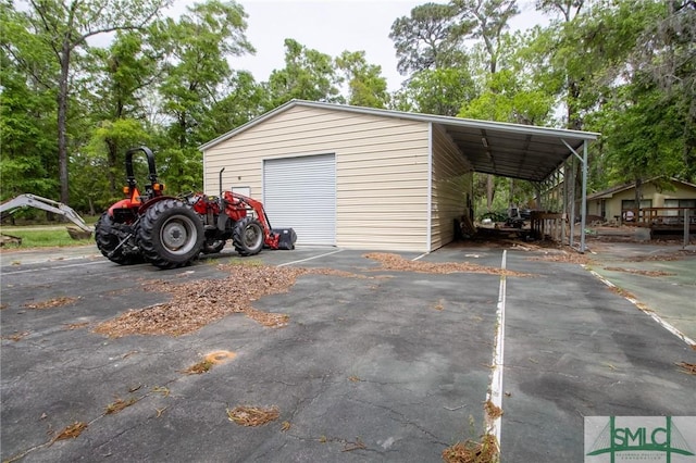 garage with a garage and driveway