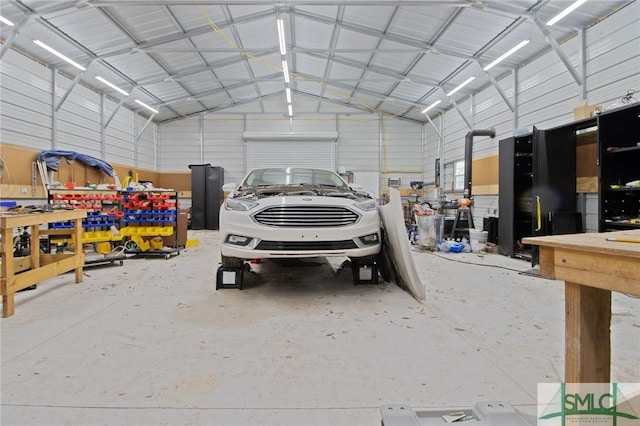 garage with metal wall and a workshop area