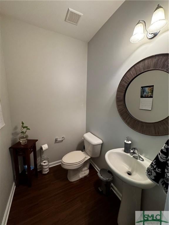 226 Ventura Pl, Pooler, GA 31322 - half bath with wood finished floors, baseboards, and toilet