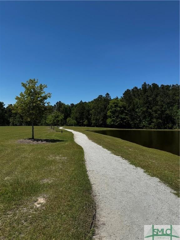226 Ventura Pl, Pooler, GA 31322 - view of community with a forest view and a yard