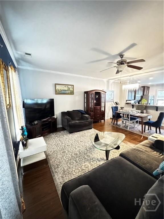 226 Ventura Pl, Pooler, GA 31322 - living area featuring a ceiling fan, wood finished floors, and crown molding