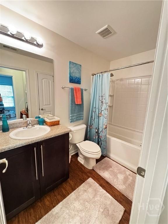 226 Ventura Pl, Pooler, GA 31322 - bathroom with wood finished floors, toilet, vanity, and shower / tub combo