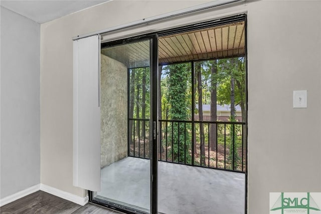 12510 White Bluff Rd Unit 1406, Savannah, GA 31419 - doorway with baseboards and wood finished floors