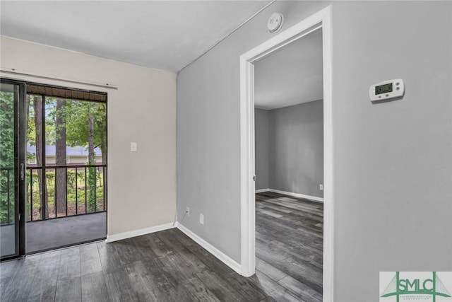 12510 White Bluff Rd Unit 1406, Savannah, GA 31419 - spare room with dark wood-type flooring and baseboards
