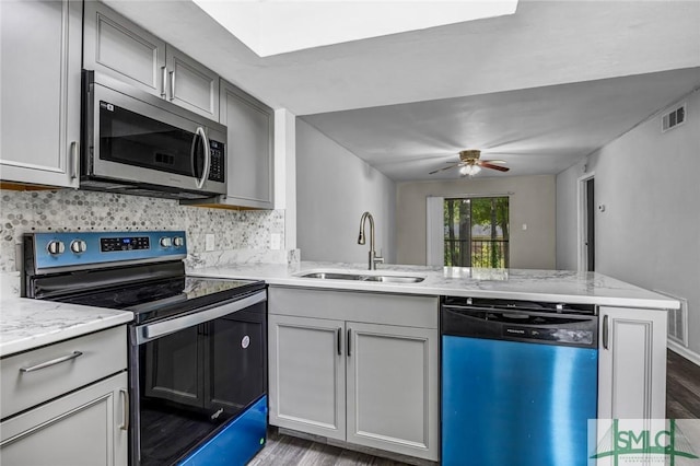 12510 White Bluff Rd Unit 1406, Savannah, GA 31419 - kitchen with dark wood-type flooring, visible vents, a sink, stainless steel appliances, and backsplash
