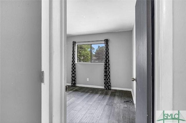 12510 White Bluff Rd Unit 1406, Savannah, GA 31419 - spare room featuring baseboards and wood finished floors